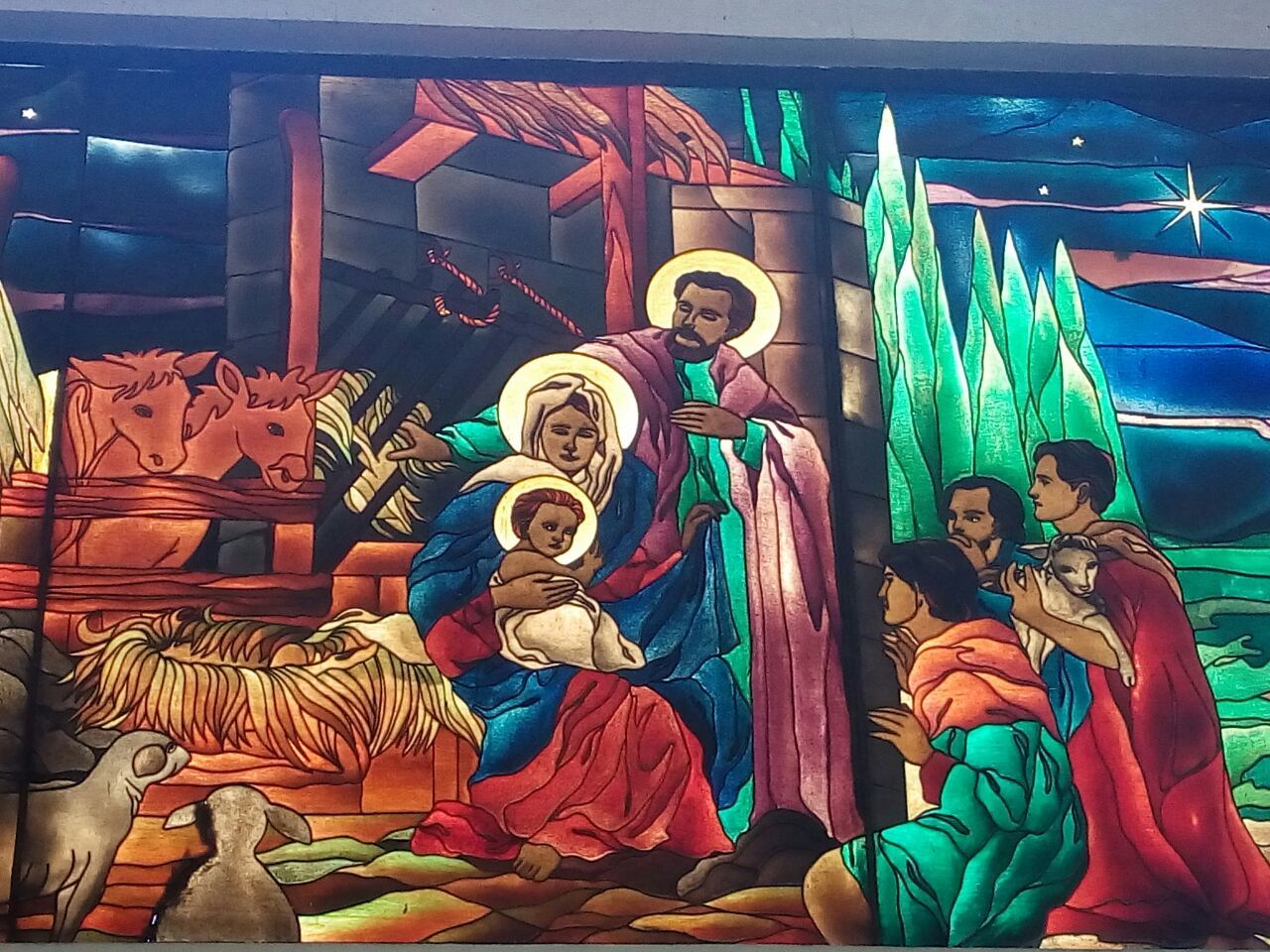 Sacra Famiglia della vetrata della Chiesa a Manila